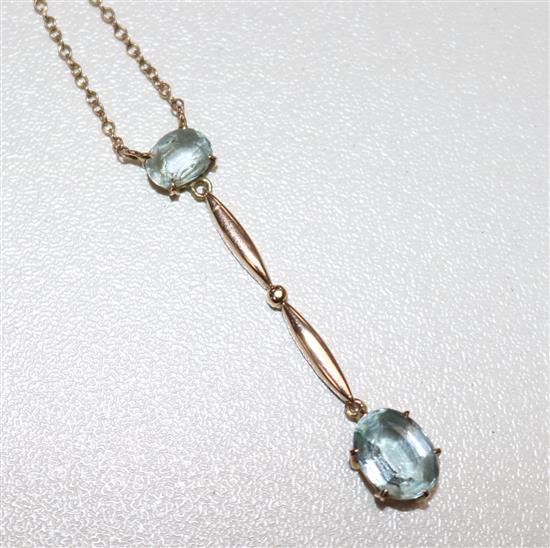 An early 20th century gold and aquamarine drop pendant necklace, pendant 1.5in.